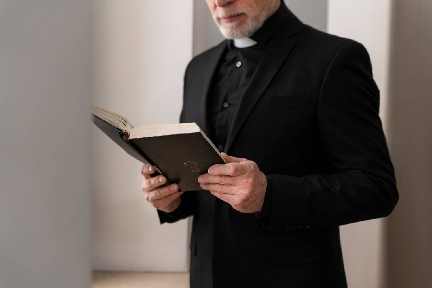 priest reading a bible